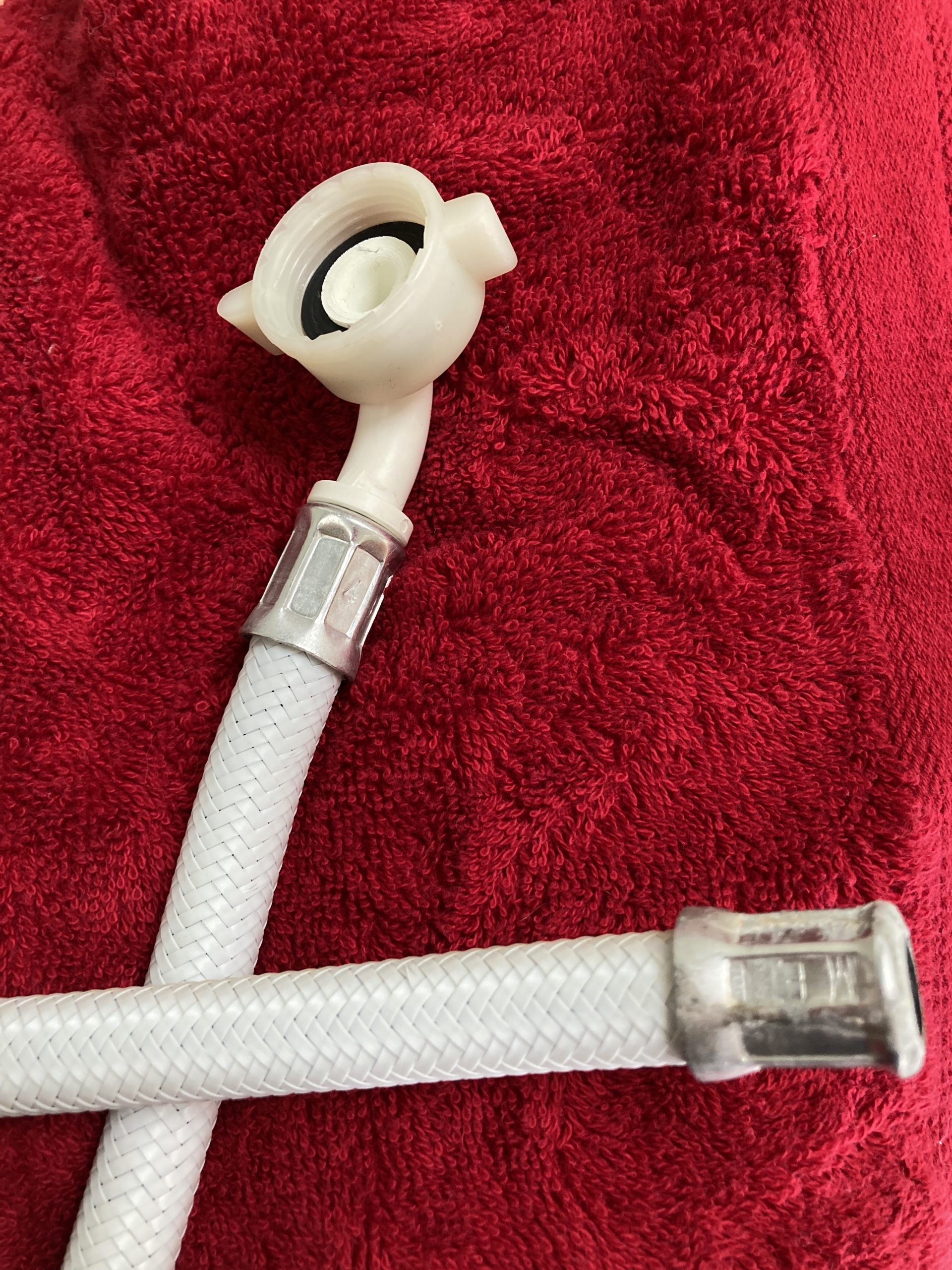 Womanaswashing machine Hose change Wendy Lawson