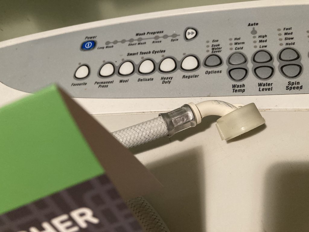 Womanaswashing machine Hose change Wendy Lawson